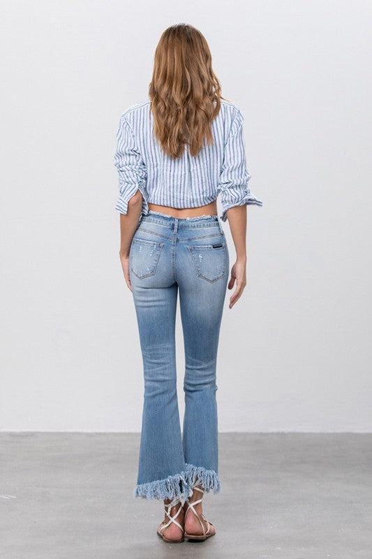 Insane Gene mid-rise light distressed crop flare jeans with frayed hem.