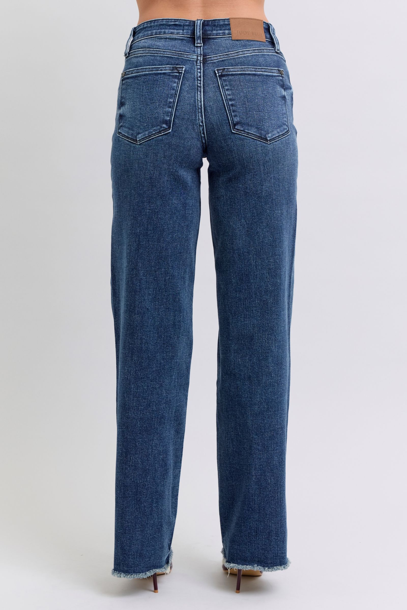 Women's mid-rise raw hem denim with moderate stretch
