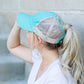 Mint distressed bun cap with Velcro closure
