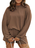 Woman wearing mocha corded two-piece shorts set with an oversized top.
