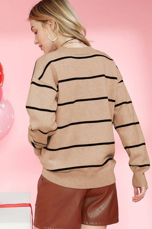 Back view of striped knit sweater in mocha, featuring classic design.
