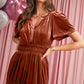 Tiered mocha velvet dress with convenient pockets and elegant design
