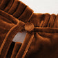 Back detail of mocha velvet top featuring a keyhole closure.
