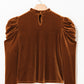 Mocha velvet frill neck top showing the keyhole back detail.
