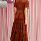 Back view of mocha velvet tiered maxi dress with short sleeves
