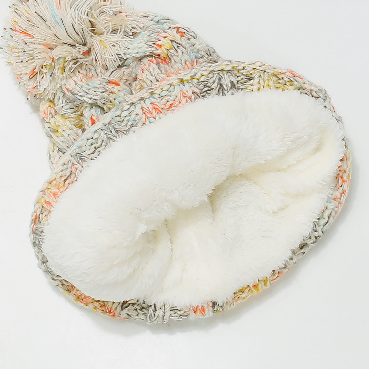 Beige multicolor knit pom-pom beanie with a soft, warm fit and colorful accents
