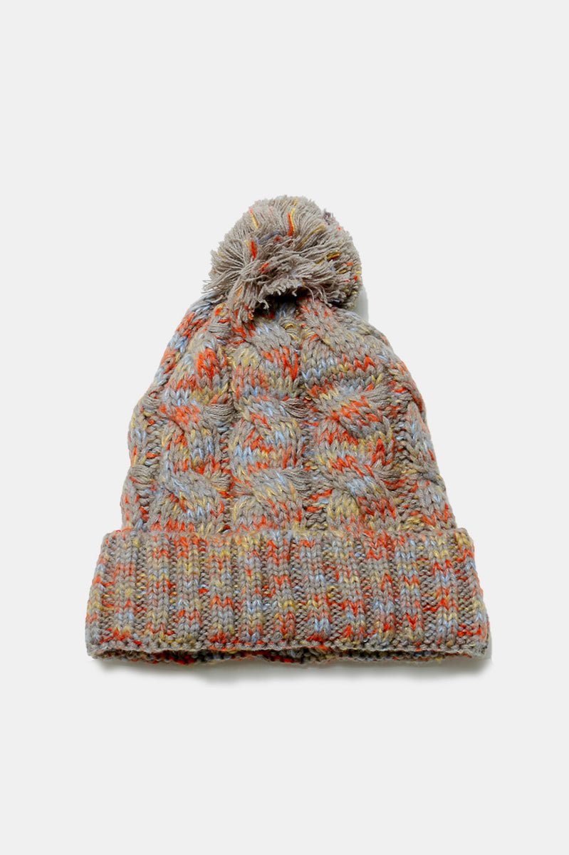 Taupe multicolor knit pom-pom beanie, ideal for staying warm with added style this winter
