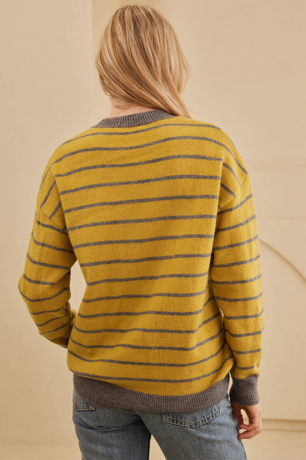 Vintage-style mustard yellow sweater featuring white flowers and gray stripes | boho aesthetic
