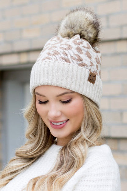 Beige CC natural leopard print beanie featuring a soft knit and playful pom
