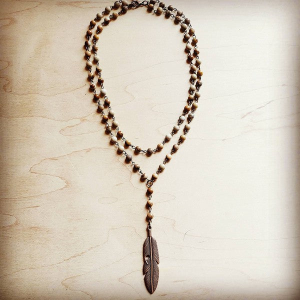 Natural gemstone lariat necklace with a feather pendant and genuine jasper beads.





