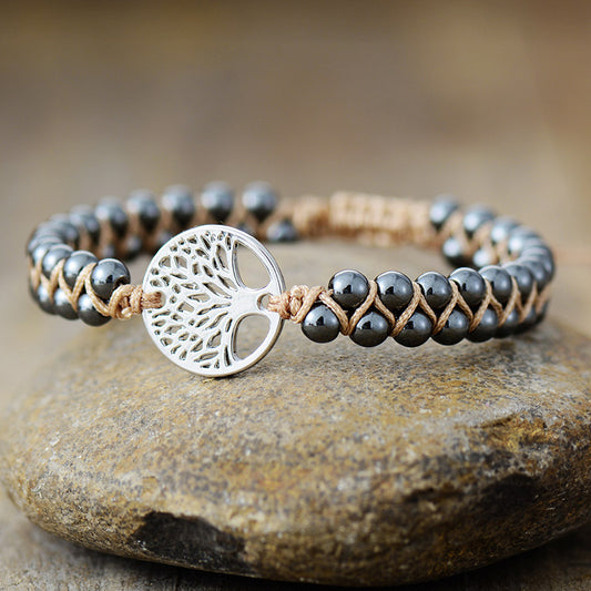 Silver braided bracelet with natural stone beads
