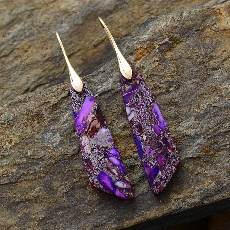 Gold drop earrings with purple natural stone design
