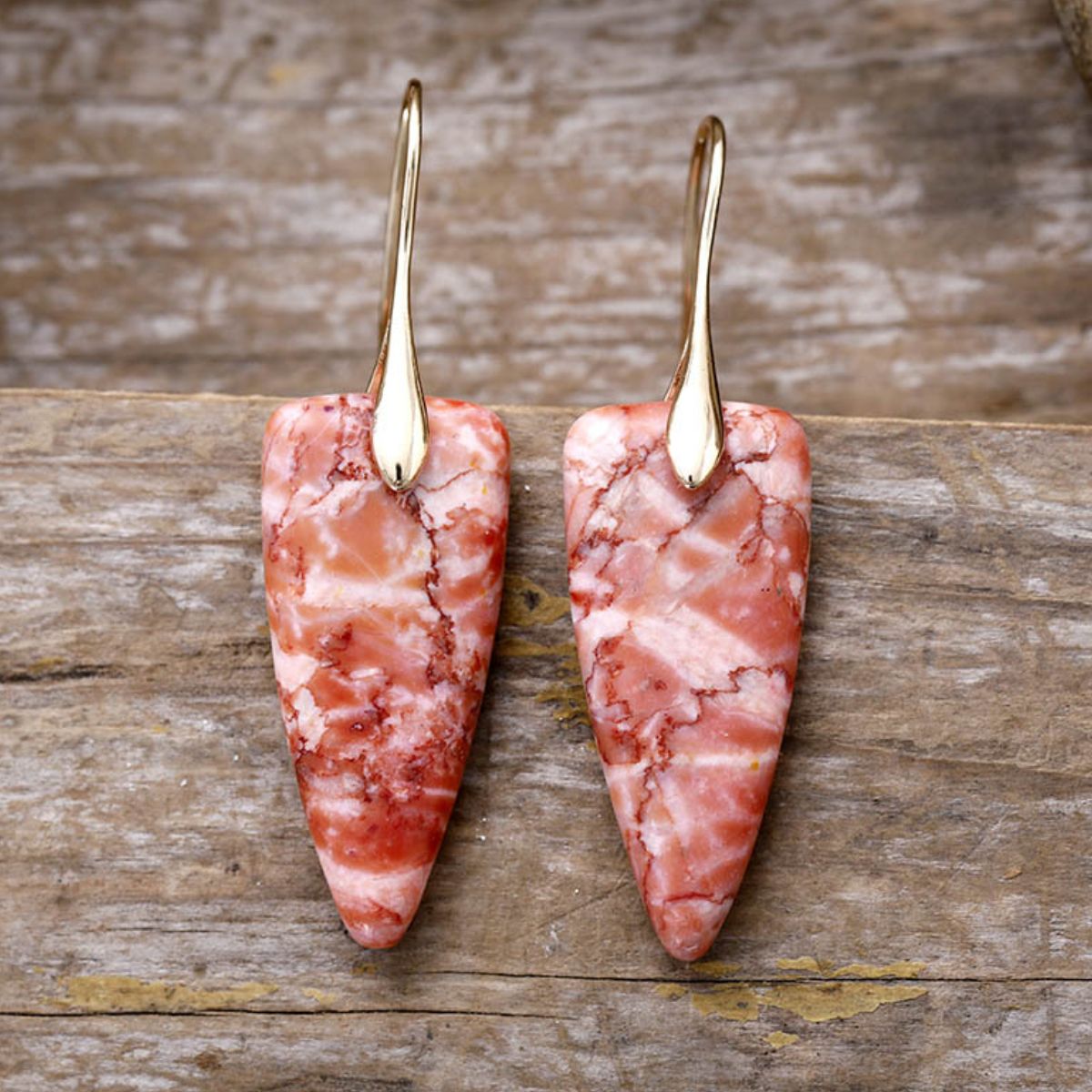 Gold geometric earrings with coral natural stone design
