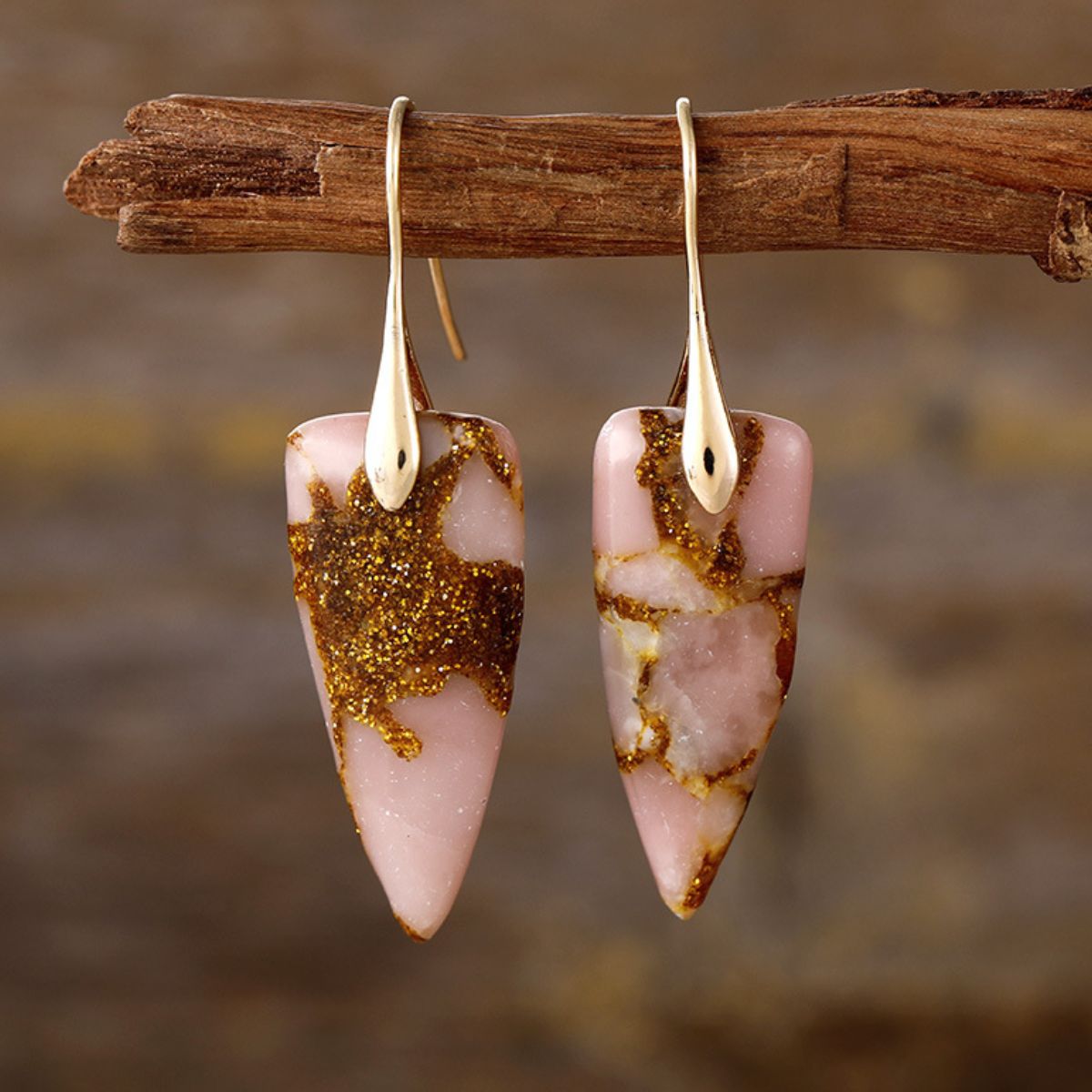 Gold geometric earrings with pink natural stone design
