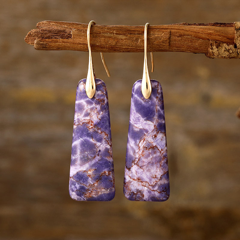 Elegant purple earrings featuring geometric shapes and gold finish
