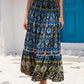 Closeup of the detailed navy bohemian print on the lightweight maxi skirt.
