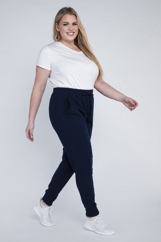 Casual navy jogger pants featuring a drawstring and comfortable fabric.
