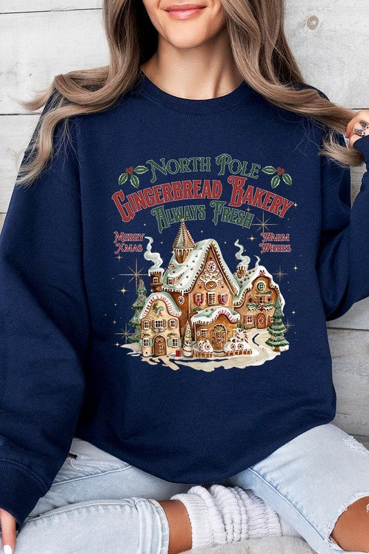 Classic navy sweatshirt with holiday-themed North Pole Gingerbread Bakery graphic.