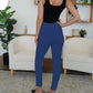 A pair of navy high-waist pants with a trendy, nautical-inspired design.