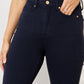 Women's navy skinny jeans with flattering control design
