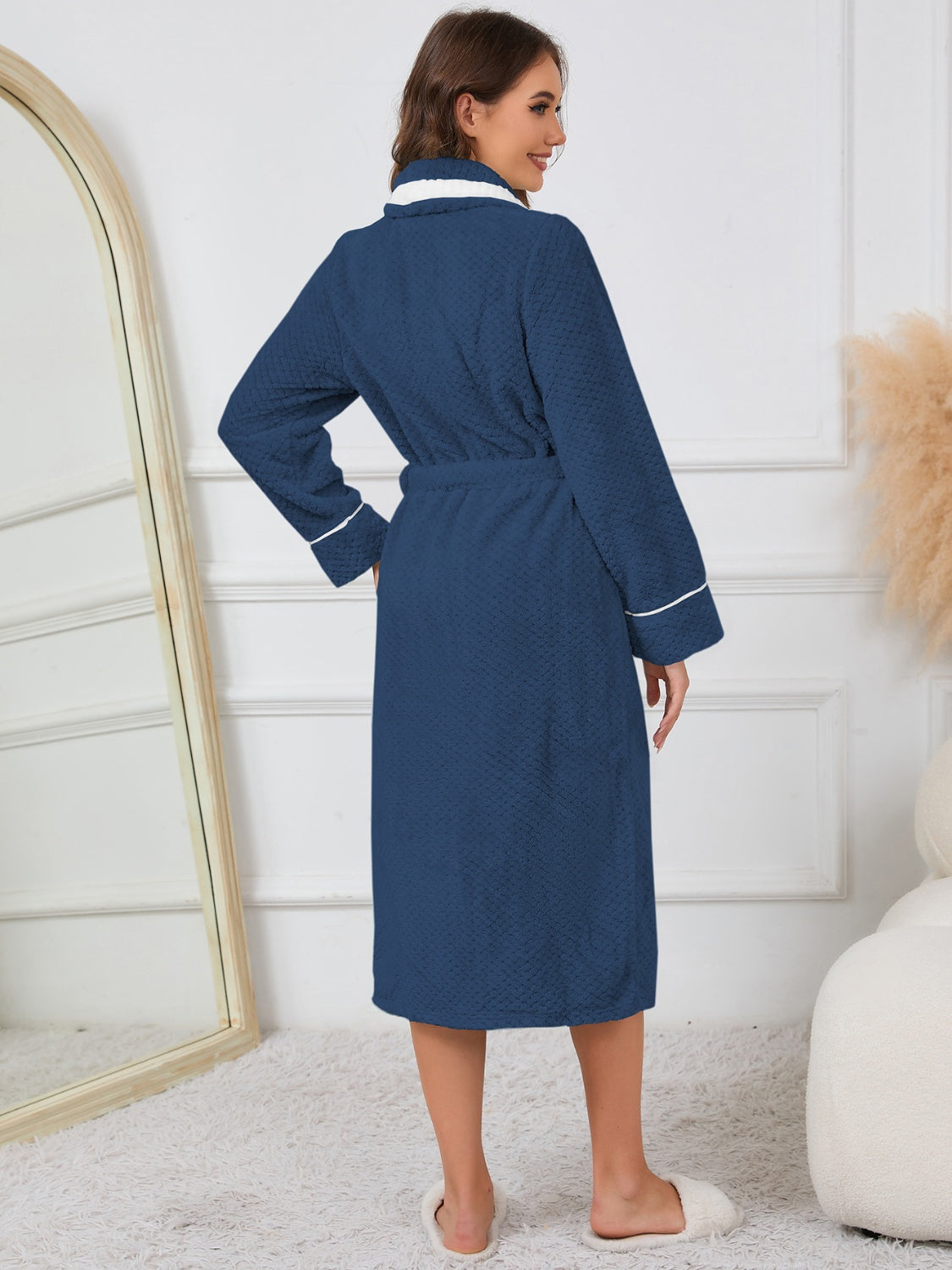 Navy plush robe with a warm, comfortable design for homewear.
