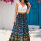 Flowing navy patchwork maxi skirt with a flattering A-line silhouette.
