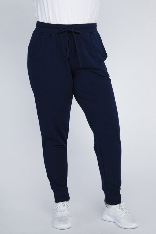 Navy plus-size jogger pants shown in a front view.
