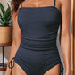 Front view of navy ribbed knit monokini with adjustable straps
