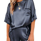 Front view of the navy satin two-piece lounge set with a relaxed fit.
