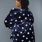 Woman wearing a belted navy plush robe with a star pattern, styled for loungewear.
