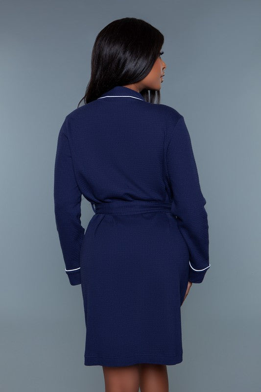 Back view of a navy waffle robe showing the belted waist and relaxed fit.
