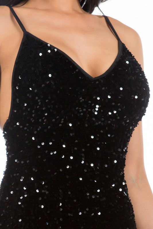 Black sequin spaghetti strap dress ideal for nights out, side view.
