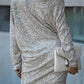 Silver sequin dress with off-shoulder neckline for a glamorous look.
