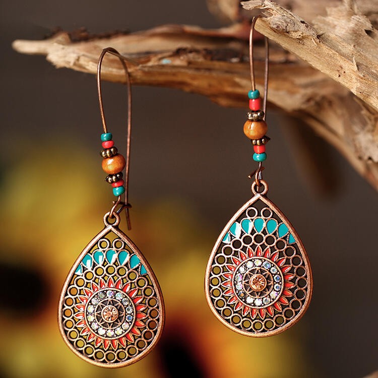 Copper teardrop earrings with oil drip and bead accents
