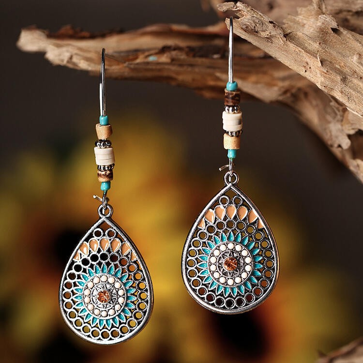 Silver teardrop earrings with oil drip and bead accents
