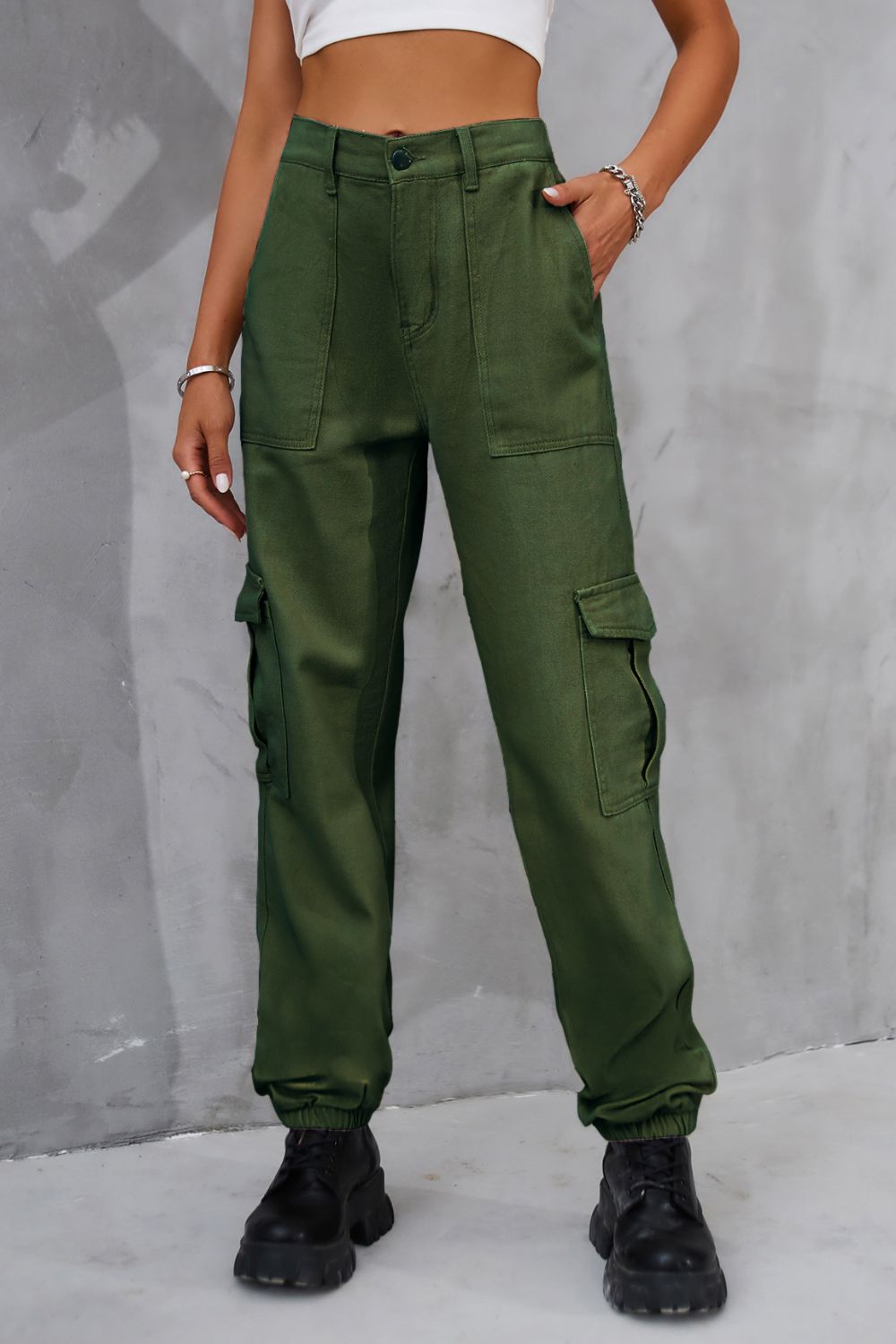 Olive buttoned high-waist cargo pants shown in a front view.
