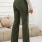 Textured olive high-waist straight-leg pants with front pockets.