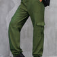 Side profile of olive high-waist cargo pants with functional pockets.
