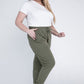 Side profile of olive jogger pants with a relaxed fit and drawstring waistband.
