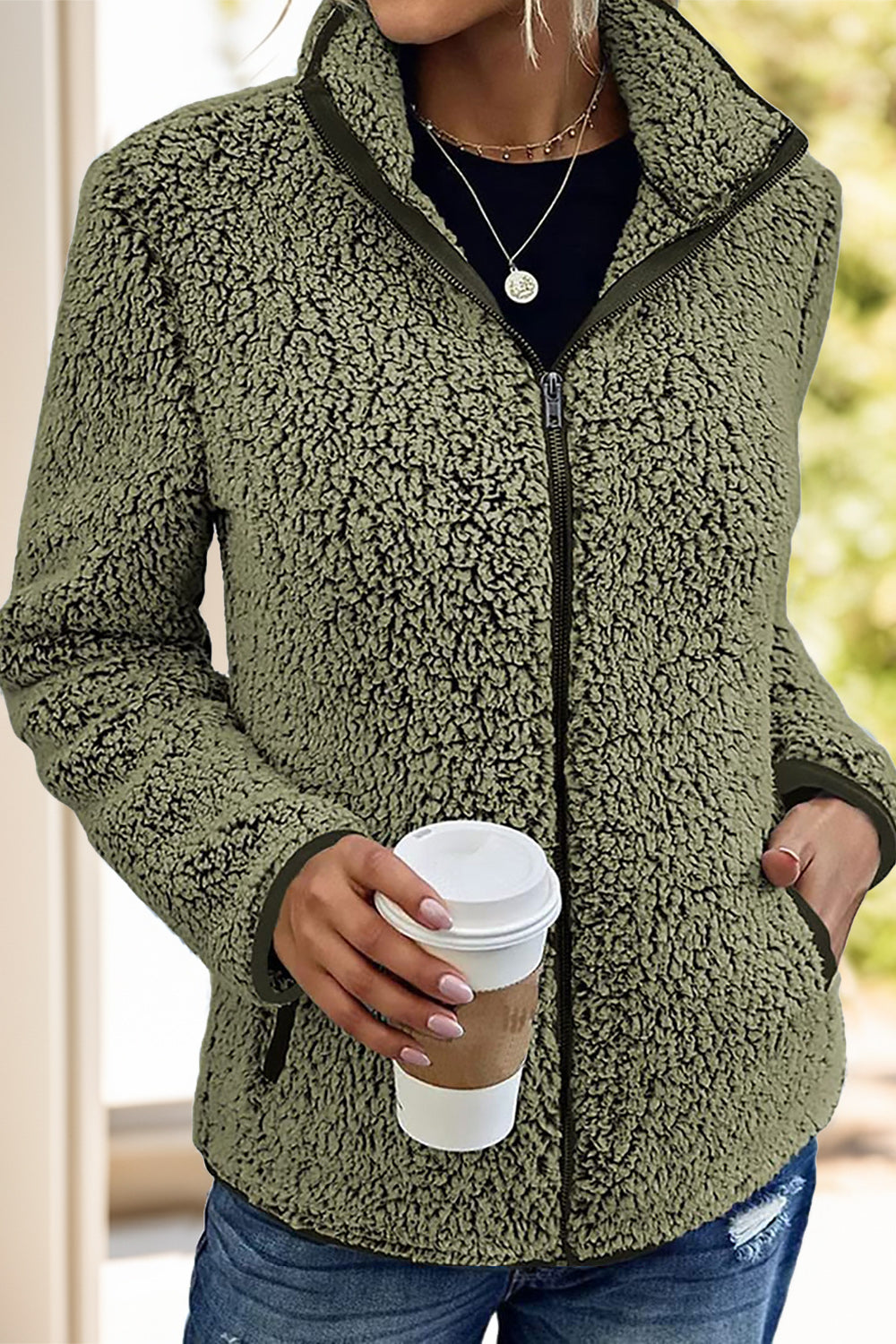 Olive women's sherpa jacket, perfect for fall and winter outdoor activities.
