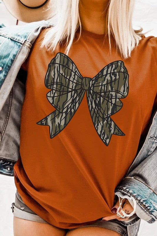 Bella + Canvas orange tee with camo bow graphic, perfect for casual looks.
