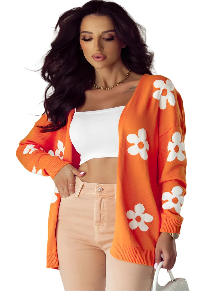 Front view of orange floral cardigan with white flowers