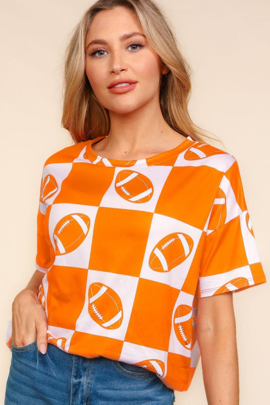 Vibrant orange and white checkerboard shirt with football graphics for game day.