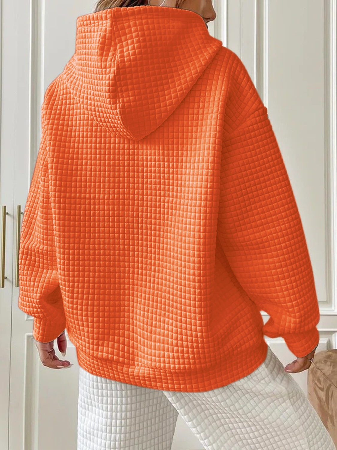 orange hoodie with drawstring and waffle knit fabric
