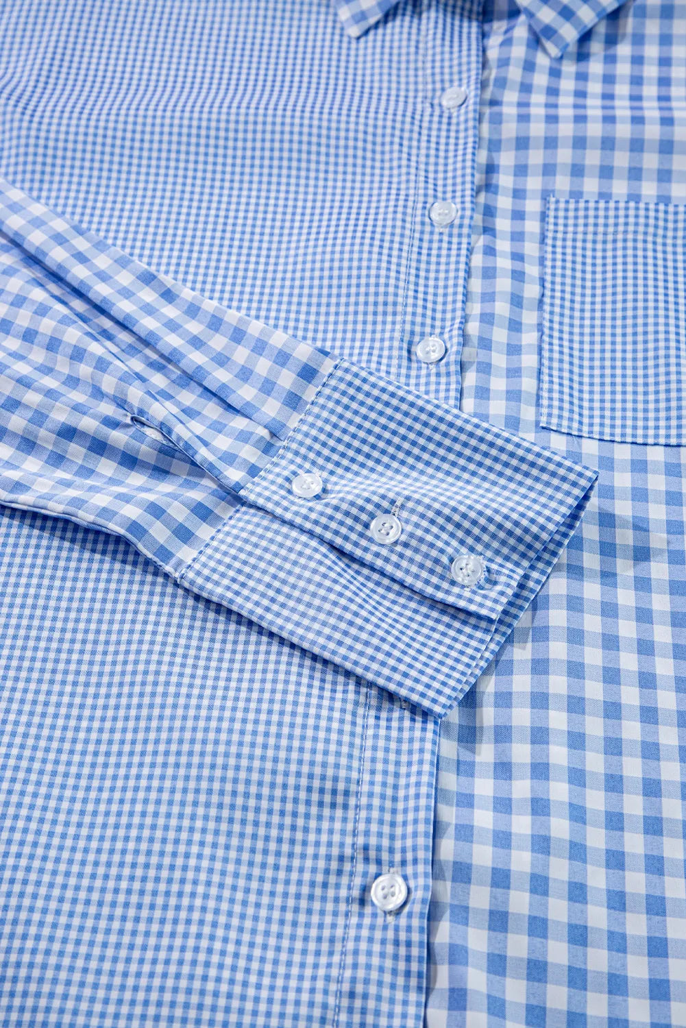 Oversized women’s blue gingham shirt styled for casual wear
