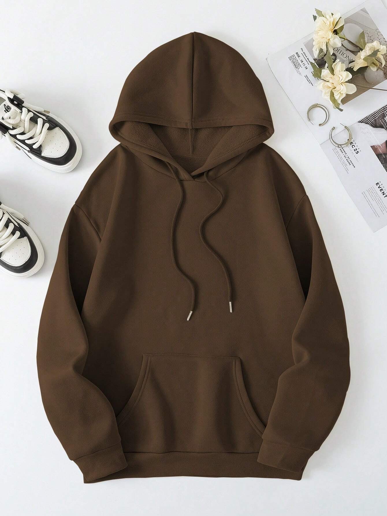 Cozy brown hoodie with "Faith Over Fear" printed on the back for an empowering statement.