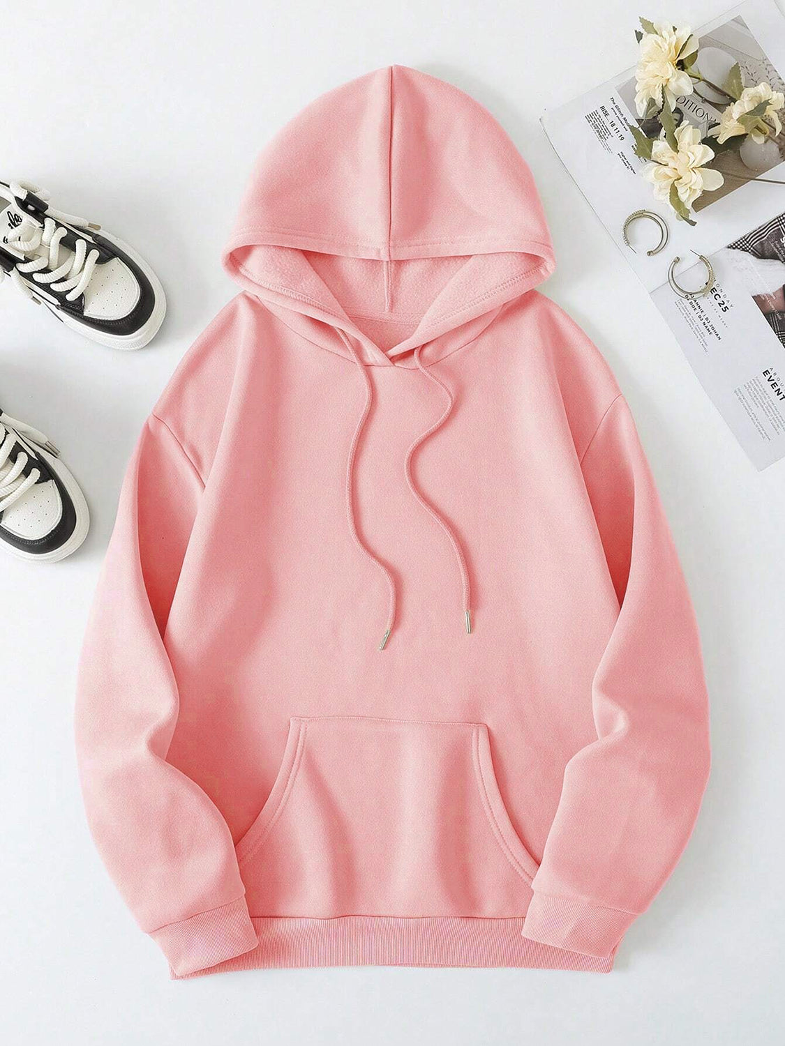 Pink oversized hoodie with a faith-filled message, perfect for cool days.