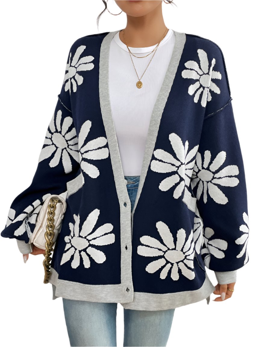 Front view of an oversized button-up floral print cardigan in navy.
