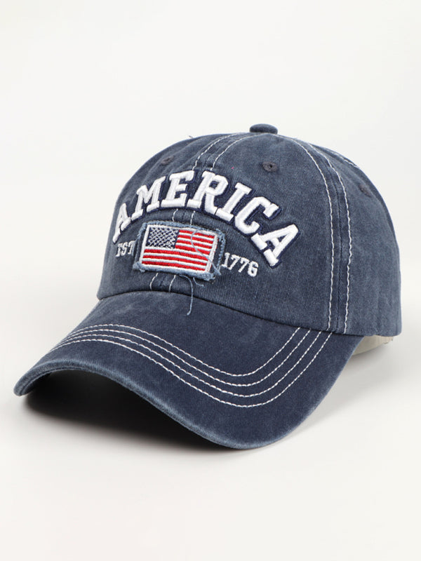 Patriotic navy denim hat featuring bold "America Est. 1776" embroidery.
