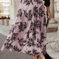 Flowy peach blossom embroidered maxi skirt with high waist design.
